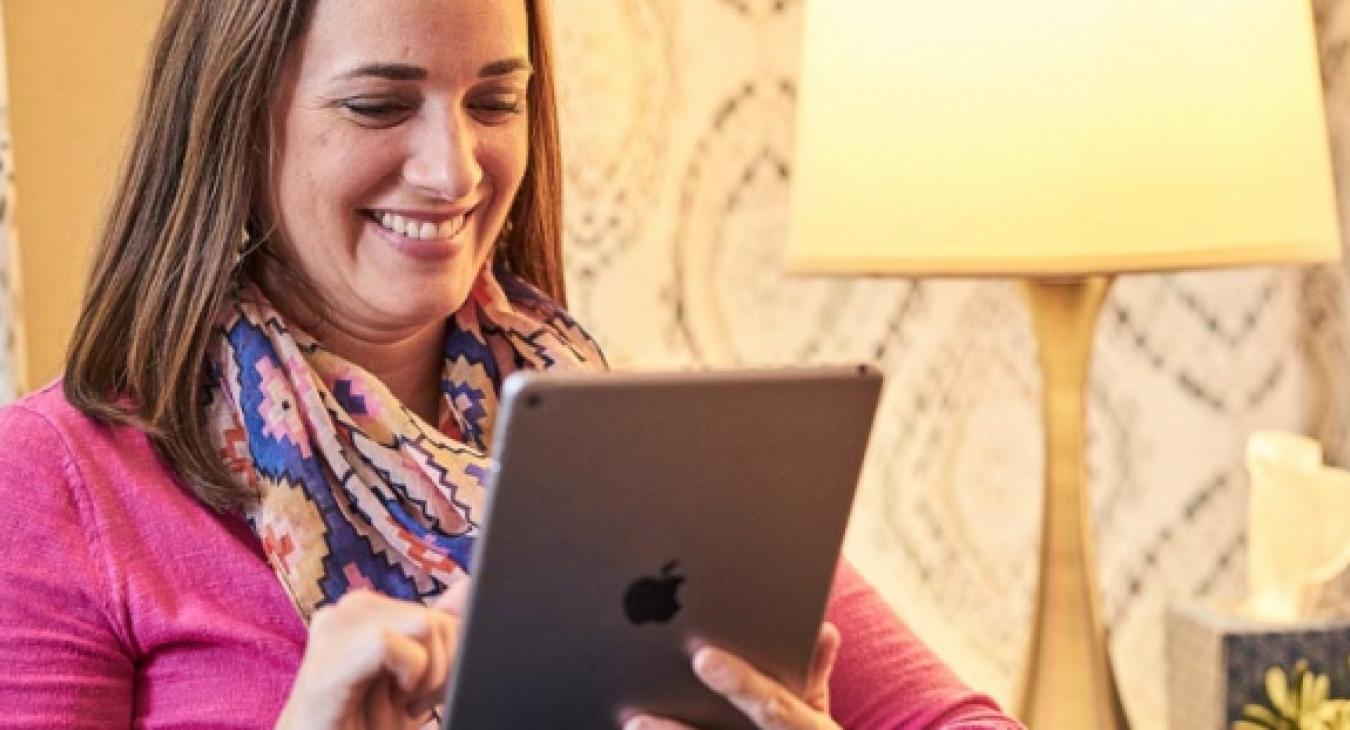 A woman reading an iPad